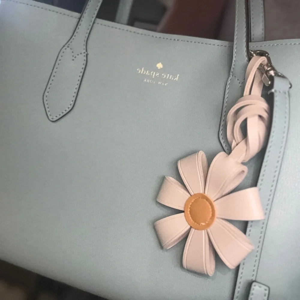 Gorgeous like new med Kate Spade Harper leather tote bag with flower bag charm. - Picture 9 of 10